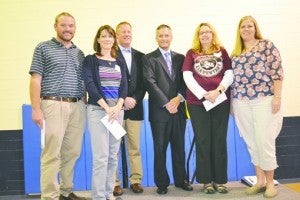 Don Phipps (third from left), superintendent of Beaufort County Schools, and WITN news anchor Dave Jordan (third from right), the Trivia Bee’s moderator, are flanked by members of the winning Treacherous Trivia Pirates team from Bath Elementary School (from left) Chris Alligood, Lorie Alligood, Gwen Jones and LeAnna Holmes.