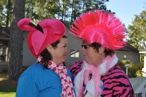 DARLENE’S FLAMINGO 5K | CONTRIBUTED Brooke Dunbar (left) and Libby Sawyer add a touch of pink and hilarity to last year’s Darlene’s Flamingo 5K. 