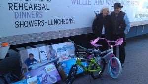 CATERERS’ CACHE: Wanda and Willie Roberson, caterers and owners of Yankee Hall, deliver a cache of toys to the Toys for Tots distribution center at St. Peter’s Episcopal Church. 