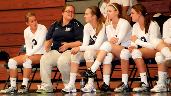 Washington volleyball coach Kelly Slade (second from left) guided the Pam Pack to its first playoff victory in over a decade and was named the WDN Coach of the Year for the second straight season. (WDN Photo/Brian Haines)