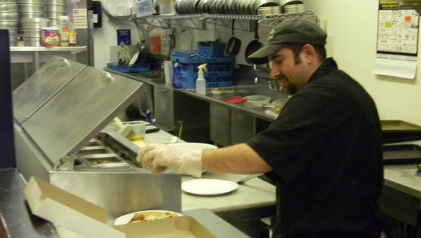 MIKE VOSS | DAILY NEWS ANTICIPATION: Craig Scichilone, master pizza-maker at La Bella Slices & Ices, will be one of the pizzeria’s staff taking care of customers during the upcoming East Carolina Wildlife Arts Festival and North Carolina Decoy Carving Championships weekend.