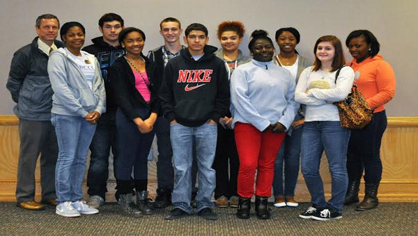 Students from Mattamuskeet Early College High School recently visited Beaufort County Community College to get a tour of the campus, where many of them will attend classes for the first time in the fall. Led by School Liaison Steve Jones and BCCC Ambassador Kenyetta Lynch, the students received an orientation in the library and toured programs of interest to them including Allied Health, Automobile Technology and Cosmetology programs. They also met with Admissions Director Daniel Wilson about college admissions and were briefed about an Agri-Business Technology Program proposed for BCCC by Arts and Sciences Dean Dixon Boyles. To date most of the students in the school have attended class, including a college student success course taught by Jones, in Hyde County. Pictured above, front row, left to right, are Lynch, and high school students Melanie McCabe, Jesus Mares, Dominque Burrus and Monica Chappell; back row, left to right, Jones, and high school students Tirzo Beltran, Dustin Eaton, Marissa Spencer, Malayaka Howard and Kayla Byrd.