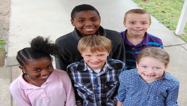 BEAUFORT COUNTY SCHOOLS | CONTRIBUTED CPS SMILES: Flashing their brightest smiles are Chocowinity Primary School students (front, from left) Laniyah Grady, Cayden Pake and Mary Grace Whitley, (back from left) Brandon Clark and Conner Sweet. 