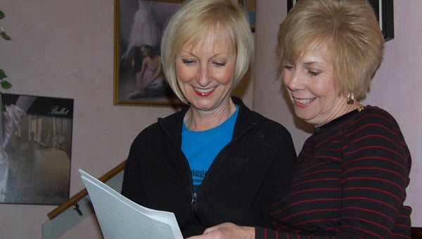 KEVIN SCOTT CUTLER | DAILY NEWS STAR SEARCH: Janet Cox (left) and Debbie Adams, directors of East Carolina Star Search, look over entry forms in preparation for Saturday's auditions at the Turnage Theater in Washington. 