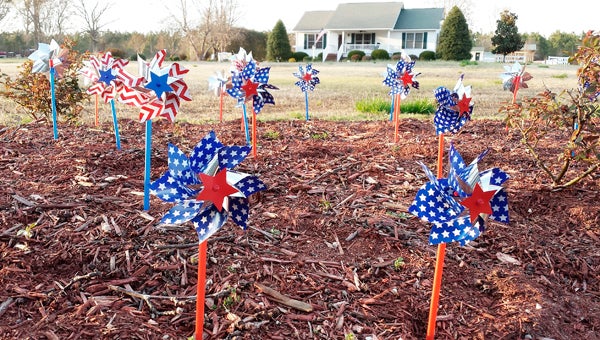 PATRIOTIC PINWHEELS: Pictures is Sarah Cutler’s personal pinwheel garden, a "Patriotic Garden" in honor of her son in the U.S. Navy. 