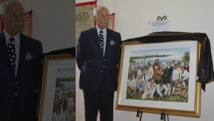 PIRATE ART: Local artist Jeffrey Jakub stands with his newly-unveiled painting titled "The Return of the Pamlico River Pirates."