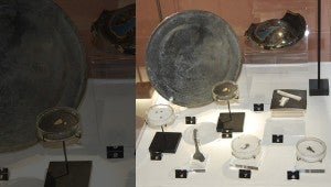 TREASURES: The exhibit includes a collection of artifacts from the Queen Anne's Revenge, including a pewter plate, a bottle fragment, gold flakes and glass beads possibly used in the slave trade. 