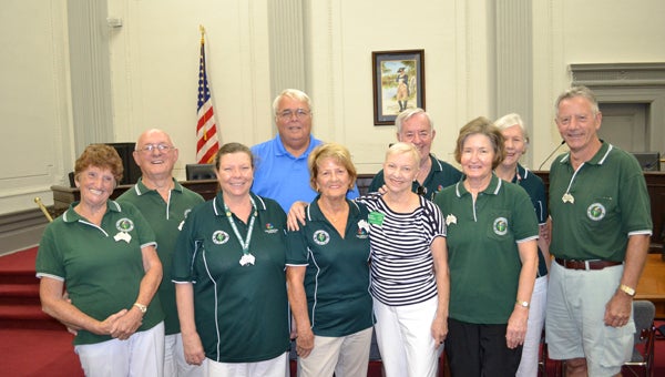 MIKE VOSS | DAILY NEWS FRIENDSHIP IN FORCE: Washington Mayor Mac Hodges (back row, second from left) greeted Friendship Force members from Australia’s Gold Coast on Friday. The visitors were accompanied by Jan Hindsley (front row, third from right), the local Friendship Force exchange director. The visitors are (front row, from left) Jo Barham, Kathy Marles, Patricia Richardson, Annette Zervaas, (back row, from left) Bob Barham, Geoff Molloy, Sandra Molloy and Henk Zervass. Hodges presented certificates naming them honorary Washington citizens to each visitor, along with gift bags containing Washington-related items.  