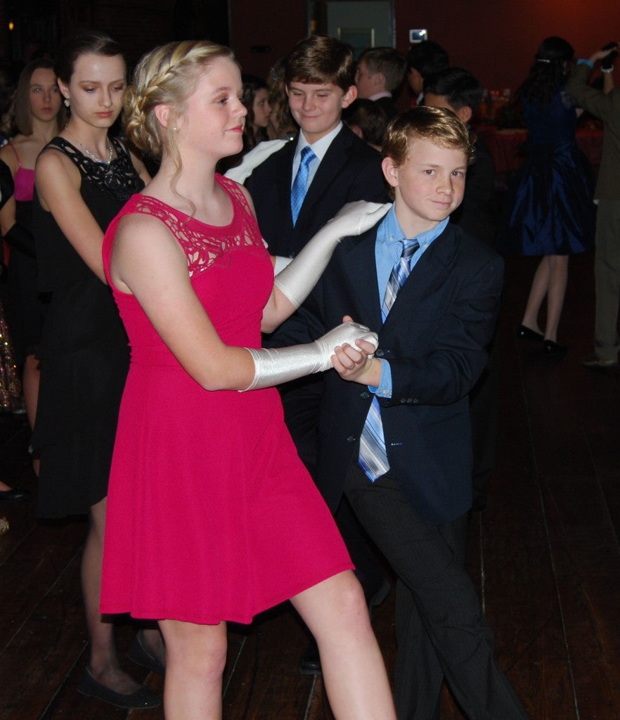 KEVIN SCOTT CUTLER | DAILY NEWS DANCING THE NIGHT AWAY: Seventh grade ballroom dance students Emme Davis and Patrick Lovenberg show off their moves during this year's Christmas Ball hosted by Le Moulin Rouge de Danse. For more on this Washington holiday tradition, see Sunday's Pamlico Life. 