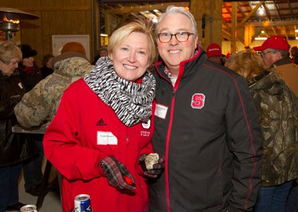 WILL PRESLAR HONORED GUESTS: N.C. State University Chancellor Randy Woodson and his wife Amy visited the home of Forrest Sidbury for the annual Beaufort County N.C. State Alumni Association oyster roast. 