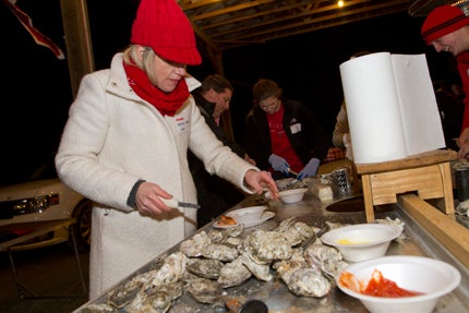 WILL PRESLAR DIG IN: Allison O’Neal hits the tables at the annual oyster roast, where alumni in Beaufort County gather for steamed oysters and camaraderie. 