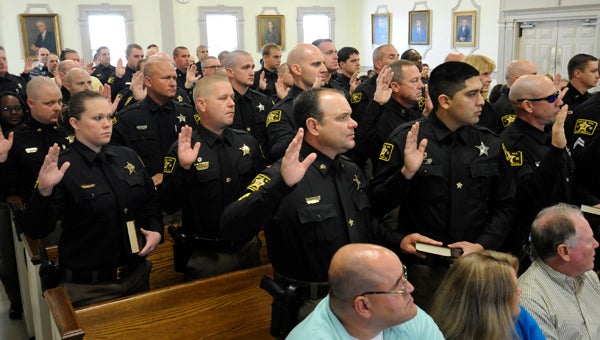 VAIL STEWART RUMLEY | DAILY NEWS LAW ENFORCEMENT: Pictured, in December, deputies with the Beaufort County Sheriff’s Office are sworn in at the Beaufort County Sheriff’s Office. Newly elected Sheriff Ernie Coleman was also sworn in. 