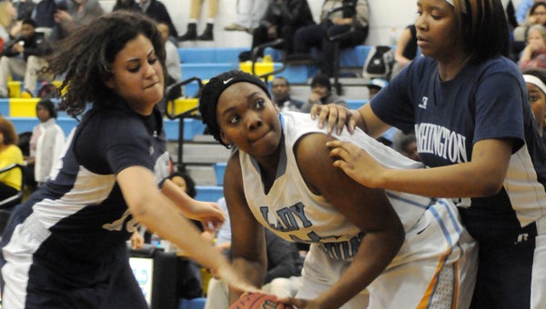 WILSON TIMES | CONTRIBUTED TOUGH LOSS: Shona Midgette and Erica Hopkins body up on a Lady Bruins’ defender during Friday’s game.