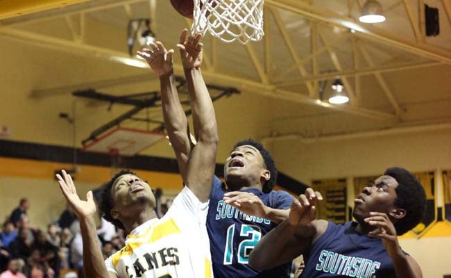NEW BERN SUN JOURNAL | CONTRIBUTED POST UP: Rashaun Moore elevates for a rebound Saturday night against Pamlico County. He finished with a team-high 26 points. 
