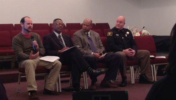 EDYTHE WILLIAMS REACHING UNDERSTANDING: A forum was recently held at St. Peter’s Baptist Church in Aurora that brought members of the community and local law enforcement agencies together to discuss the roles and responsibilities that each must uphold to coexist harmoniously. Pictured are panel members representing local enforcement: (from left to right) Aurora Police Chief Mike Harmon; Aurora Police Commissioner W.C. Boyd; Beaufort County Police Activities League Director Alvin Powell, who is also a retired FBI agent; and Chief Deputy Charlie Rose of the Beaufort County Sheriff’s Office. 