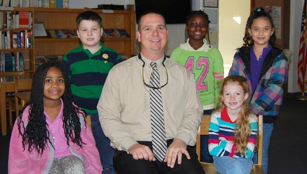 CHOCOWINITY PRIMARY SCHOOL CPS PRINCIPAL PAGES: Chocowinity Primary School congratulates the latest students to be chosen as principal pages. Pictured with Assistant Principal Spencer Pake, they are (seated) TaiAsia Price and Leanna Hudson, and (standing from left) Shane Zettlemoyer, Tyshana Purdue and Victoria Ramirez Diaz. The pages will assist Pake and CPS Principal Alicia Vosburgh with special projects over the next few weeks. 