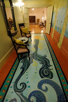VAIL STEWART RUMLEY | DAILY NEWS PAINTED LADY: Murals by Tabitha Ferrell add a whimsical element to the staircase and entry of Spring Hill at the Buckman. This mermaid spans the length of a long hall into the roomy event space. 