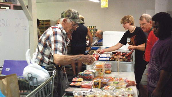 FILE PHOTO | DAILY NEWS FIGHTING POVERTY, HUNGER: Eagle’s Wings, a Washington-based food pantry, helps battle poverty and hunger by providing food to deserving people in the area.
