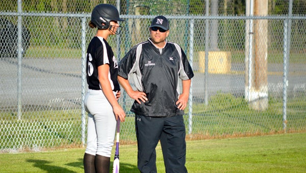 DAVID CUCCHIARA | DAILY NEWS TALK IT UP: Northside softball head coach Riley Youmans talks with senior Kelsey Lang before an at bat earlier this month. The Panthers remain undefeated heading into the final stretch of regular season games. 