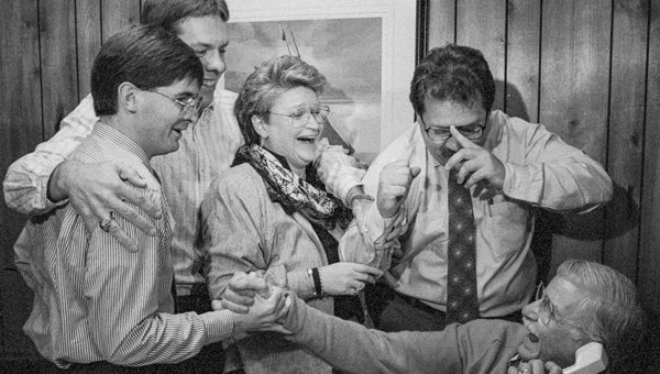RIC CARTER THE HIGHEST HONOR: (From left to right) News Editor Mike Adams, Brownie Futrell, Betty Mitchell Gray, Mike Voss and Bill Coughlin are pictured at the very moment Coughlin was told the Washington Daily News had won the Pulitzer Prize gold medal for Meritorious Public Service on April 12, 1990. 
