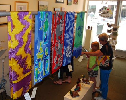 Kevin Scott Cutler | Daily News ART SHOPPING: Hand-painted silk scarves by Susan Owens of Roper add a vibrant splash of color to the Lane Gift Shop and Gallery, operated by the Beaufort County Arts Council and housed in the Turnage Theater. 
