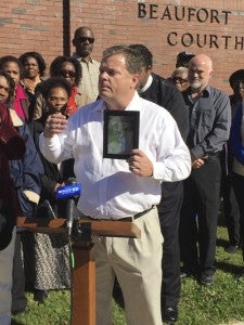 CAROLINE HUDSON | DAILY NEWS RALLYING CALL: Belhaven Mayor Adam O’Neal holds a picture of Portia Gibbs, a Belhaven resident who passed away from a heart attack about a week after Vidant Pungo Hospital closed in 2014. 