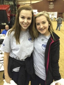 CAROLINE HUDSON | DAILY NEWS CHECKING IT OUT: Pictured are Cameron Bunn (left) and Amelia Woolard, who are both freshmen at Northside High School. They said they enjoyed exploring all of the Ag expo exhibits. 