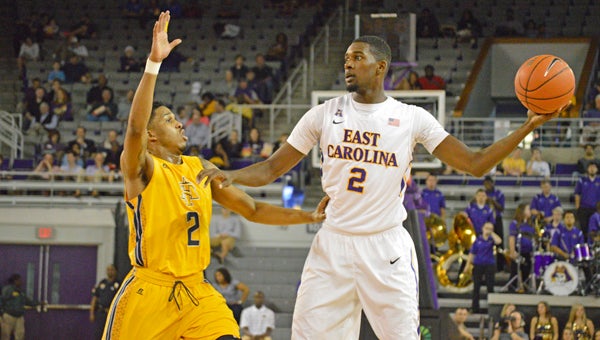 MICHAEL PRUNKA | DAILY NEWS SURVEYING: Junior forward Caleb White looks around for a play to make against NC A&T. He scored 20 points in ECU’s loss at JMU. The Pirates have been successful at home thus far, but have struggled on the road this season. 