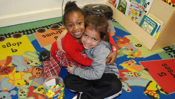 CAROLINE HUDSON | DAILY NEWS BEST FRIENDS: Si'Ajah (left) and Summer play together in one of the centers set up in Danielle Price’s classroom at Eastern Elementary School. 