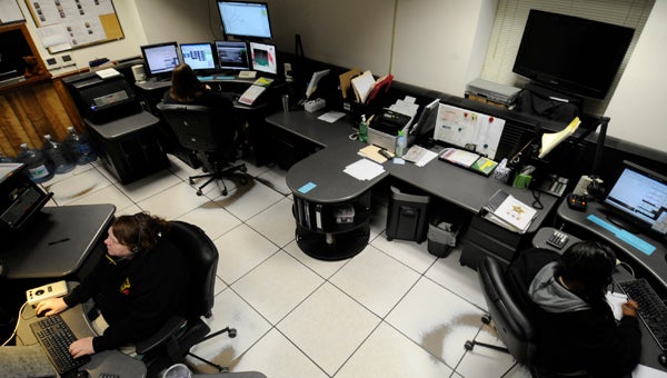 VAIL STEWART RUMLEY | DAILY NEWS CONTROL CENTER: Telecommunicators answer incoming calls at the Beaufort County Sheriff’s Office 911 Center. As of Wednesday, they will be able to help 911 callers through certain medical emergencies while EMS is in route.