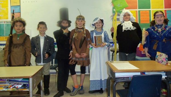 TERRA CEIA CHRISTIAN SCHOOL BIOGRAPHIES: Some of the Terra Ceia Christian School third- and fourth-graders presented their biographies before Christmas. Pictured is Dustin Carrow as Daniel Boone, Tomi Schuman as George Washington, Keira Budge as Abe Lincoln, Alden Taylor as Squanto, Gabriella Jordon as Laura Ingalls Wilder, Lily Jefferson as Ben Franklin and Heather Rogers as Pocahontas.   