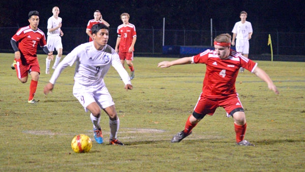 MICHAEL PRUNKA | DAILY NEWS FANCY FOOTWORK: Freddy Jimenez makes a quick, simple move to beat a North Johnston defender when the two sides met for a third time in the state playoffs. Jimenez was named the 2-A Eastern Plains Conference Player-of-the-Year. 