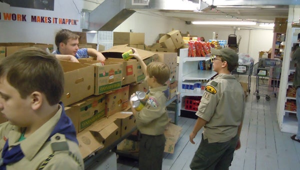 BEN MORRIS MEETING NEEDS: Pictured are members of Boy Scout Troop 21 of Washington. The troop participated in last year’s Scouting for Food initiative and collected canned, boxed and dry goods for local food pantries, which, in turn, disperse to those in need in the community. 