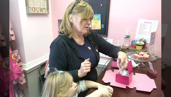 CAROLINE HUDSON | DAILY NEWS LITTLE SHOP: Patricia Roseman opened Patty Cakes in January, and her shop specializes in cake truffles and gourmet mini cupcakes.