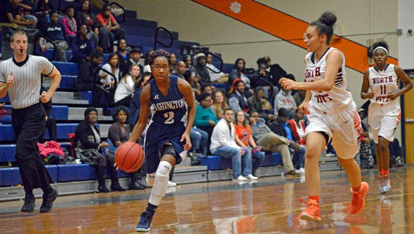 MICHAEL PRUNKA | DAILY NEWS PUSHING FORWARD: Cierra Wiggins leads a fastbreak for Washington in a regular-season game against North Pitt. The Lady Pack nearly knocked off the conference’s top team, but fell victim to a last-second shot. 