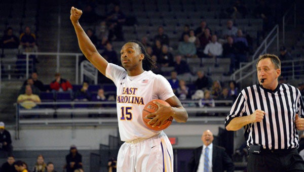 MICHAEL PRUNKA | DAILY NEWS SLOW IT DOWN: Kentrell Barkley gets the ball on the perimeter and calls for the Pirates to slow it down a bit. He scored 20 points for ECU and grabbed a career-best 14 rebounds in the triple-overtime loss. 
