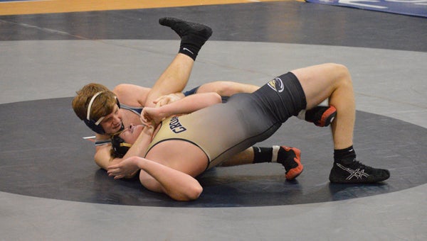 MICHAEL PRUNKA | DAILY NEWS ON HIS BACK: Andrew Ferguson tries to pin Croatan’s Dawson Poston. Ferguson ended up getting the fall to earn Washington’s first points of the match and ignite a comeback that nearly knocked off one of the best teams in the east. The Pam Pack’s elimination is the first preseason objective missed.  