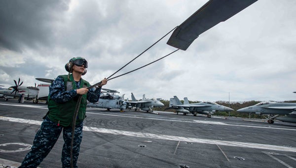 U.S. NAVY MASS COMMUNICATION SPECIALIST TOMAS COMPIAN ON DECK: Aviation Structural Mechanic 2nd Class Danyelle Jedlicka, from Chocowinity, performs a preflight check on the rotor of an MH-60S Sea Hawk assigned to the Chargers of Helicopter Sea Combat Squadron (HSC) 14 on USS John C. Stennis' (CVN 74) flight deck, located in Apra Harbor, Guam. Providing a combat-ready force to protect collective maritime interests, Stennis is operating as part of the Great Green Fleet on a regularly scheduled Western Pacific deployment. 
