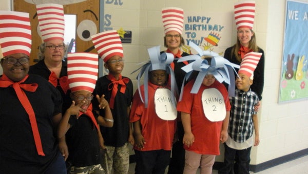 JOHN SMALL ELEMENTARY SCHOOL CAT IN THE HAT: On March 2, Amy Craft’s class celebrated Dr. Seuss’ birthday. The students started the festivities by dressing up as the Cat in the Hat, Thing One and Thing Two. They enjoyed “green eggs” for snack — made with vanilla pudding, green food coloring and a vanilla wafer as the yoke. The students competed in friendly games involving reading skills, read some of Dr. Seuss’ books, such as “Green Eggs and Ham” and “One Fish, Two Fish, Red Fish, Blue Fish,” making crafts to go along with these books. To end the celebration, the class enjoyed the movie “The Lorax.”  The classroom door will display the Cat in the Hat during the month of March to show the importance of reading and the joy of books.  