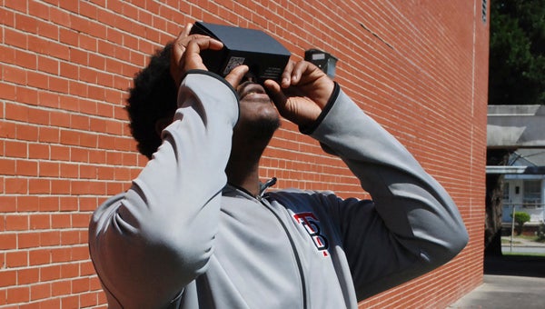 CAROLINE HUDSON | DAILY NEWS HOW IT WORKS: Felix Burgess, a senior at Beaufort County Ed Tech Center, demonstrates how to use Google Cardboard goggles. 