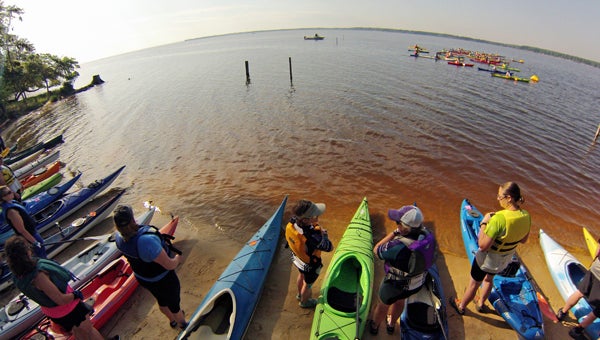DAILY NEWS ONE OF A KIND: “Fitness” magazine once called Sound Rivers’ Race for the River Kayakalon a “race that shouldn’t be missed.” Consisting of three legs — kayaking, cycling and running — the race will be held at Goose Creek State Park on Saturday. Pictured, past Kayakalon-ers prepare to head out into the Pamlico River.