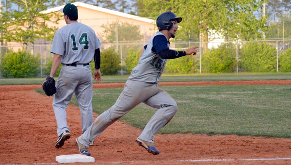 MICHAEL PRUNKA | DAILY NEWS ROUNDING THIRD: Hunter Sparks touches third base briefly on his way home during the seventh inning of Southside’s 9-0 victory over Kinston.  