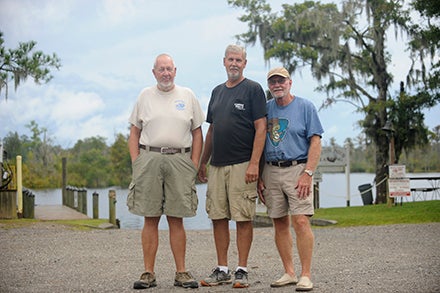  ON THE CREEK: (From left to right) Capt. Bob Boulden, Jimmy Daniels, owner of Cotton Patch Landing, and Bob Daw, a resident on Blounts Creek, rely on the health of the Blounts Creek —Boulden and Daniels for their livelihood; Daw, for quality of life. 