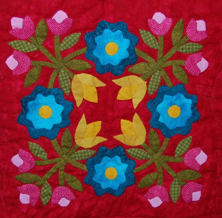 CHRISTMAS JOY: This detail of Gwen Estep's "Christmas Joy" appliqued wall quilt shows her attention to detail.