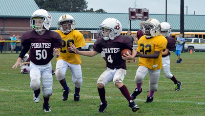 8U Bath Pirates’ Chase Marshal waits for a block as he tries to push forward against Chocowinity.