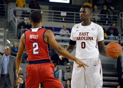 Deng Riak sizes up a Florida Atlantic defender last season. Riak only played in a few games before suffering a season-ending shoulder injury. His return this year bolsters ECU’s depth at the forward positions.