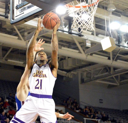 B.J. Tyson drives to the hoop for a layup. Tyson had 12 points and some explosive plays in ECU’s win on Thursday.