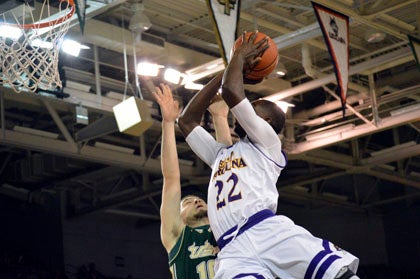 Raquan Wilkins drives into the paint against USF on Wednesday. Head coach Jeff Lebo is hoping ECU can heat up a bit from behind the arc so as to open things up inside.
