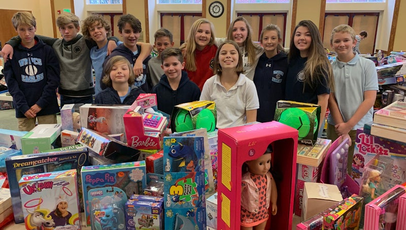 Local students help prepare Toys for Tots - Washington Daily News ...